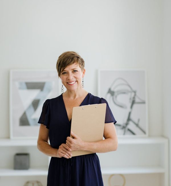Portrait of a friendly and professional female instructor smiling warmly.
